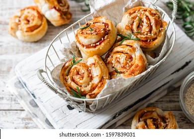 Unsweetened snails and puff pastry with bacon and sesame seeds. Comfortable and simple food.