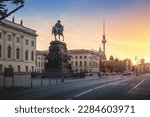 Unter den Linden Boulevard with Fernsehturm TV Tower and Frederick the Great Statue at sunrise  (sculpture by Christian Daniel Rauch, 1851) - Berlin, Germany