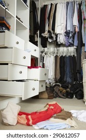 Untidy Teenage Bedroom With Messy Wardrobe