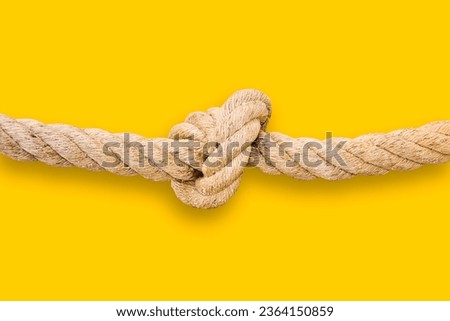 Untie the knots - problem solving concept image on yellow background