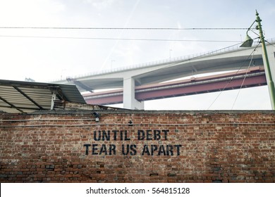 'Until Debt Tear Us Apart' graffiti