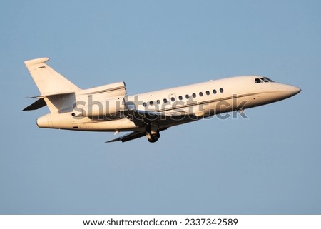 Untitled business jet passenger plane at airport. Corporate flight travel. Aviation and aircraft. Vip transport. Company and corporation transportation. Fly and flying. Commercial theme.