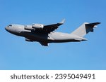 Untitled military transport plane at air base. Airport and airfield. Air force and army flight operation. Aviation and aircraft. Air lift. Military industry. Fly and flying. Commercial theme.