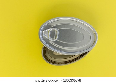 An Unused Anchovy Tin Can On A Yellow Background