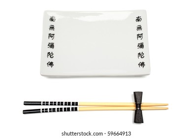 Unused japanese chopsticks and dishware isolated on white background.