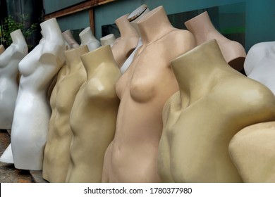 Unused Mannequin Body. Naked Manequins In Second Hand Shop. The Scrap Of Naked Body Model For Cloth Fashion On The Street Shop.