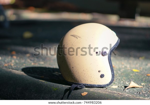 unused motorbike\
helmet on floor at\
morning