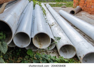 unused plastic paralon pipes to make waterways - Shutterstock ID 2044058408