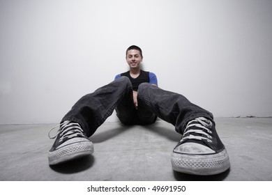 Unusual Angle Of A Young Man Sitting