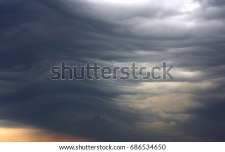 unusual dark gray layered stratus clouds, aerial view, skyscape