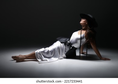 unusual interesting outfit for the bride, stylish outfit white long dress and black leather peplum on belt - Shutterstock ID 2217233441