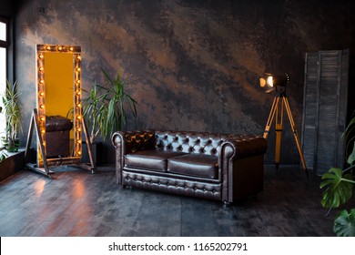 unusual loft interior. leather sofa. room in brown color. luxury livingroom