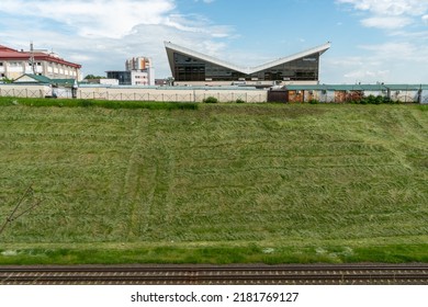 An Unusual Office Building Made Of Glass And Concrete With An Uneven Angular Roof. Modern Futuristic Design Of The Building Of The Future.