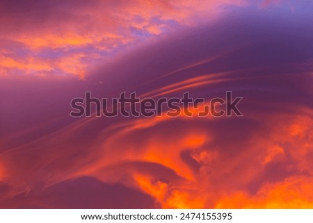 Unusual storm clouds at sunset.  Suitable for background.