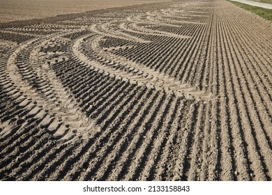 Unusual Tyre Marks In A Field Driven By A Tractor.