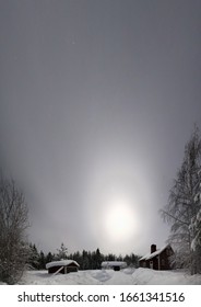 Unusual Vertical Panoramic Shot Of Swedish Wood House In Misty Night.