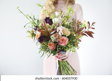 Unusual Wedding Stylish Bouquet With Orange And White Flowers In Hands Of A Bride 