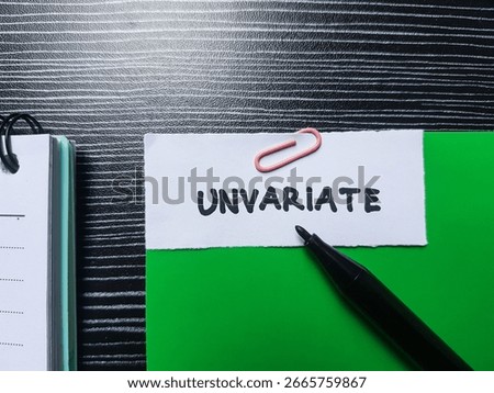 Unvariate writting on table background.