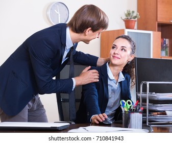 Unwanted  Behaviour Chief Flirting With Manager At Work In Office