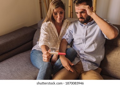Unwanted Pregnancy, Contraception Fail, Safe Concept. Frustrated Couple Checking A Pregnancy Test