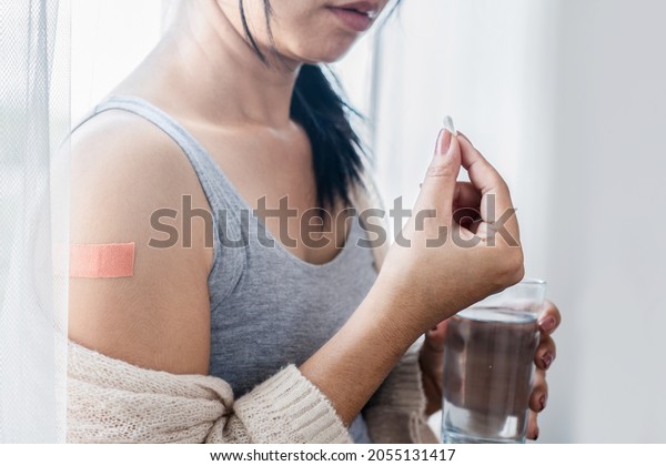 unwell-woman-taking-paracetamol-medicine-after-stock-photo-2055131417