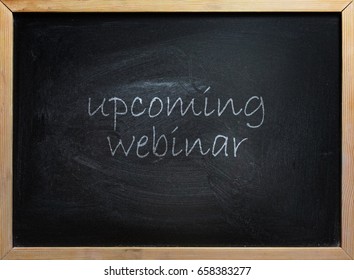 Upcoming Webinar Text Writen On Black School Board With Wooden Frame.
