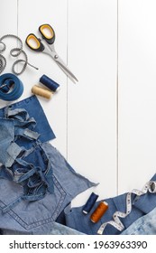 Upcycle Old Denim Garbage. Recycling Blue Jeans Cut Pieces, Sewing And Home Needlework. Recycling And Scissors On White Background. Circular Economy. Zero Waste Banner With Copy Space. DIY Concept