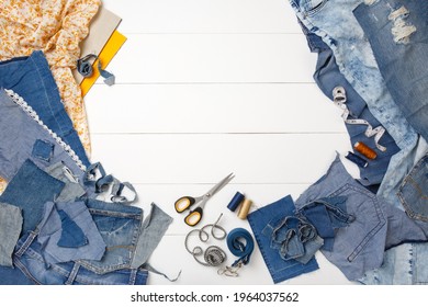 Upcycle Old Denim Garbage. Recycling Blue Jeans Cut Pieces, Sewing And Home Needlework. Recycling And Scissors On White Background. Circular Economy. Zero Waste Banner With Copy Space. DIY Concept