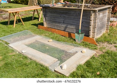 Upcycling-raised bed with mill-grille on stones as a substructure - Shutterstock ID 676132276