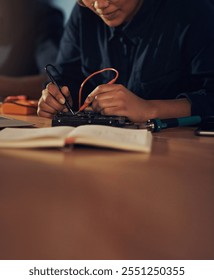 Update, electrical engineer and hands with tools, hardware and working in office, table and specialist. Digital, technician and maintenance for computer, repair and service for system and soldering
