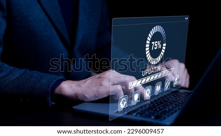 Update software application and hardware upgrade technology concept. User is using a notebook software update or operating system upgrade, updating progress bar on computer screen, Install app patch,