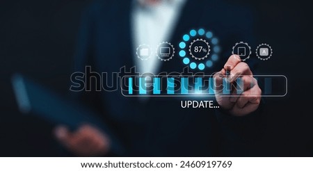 Updating computer system software application installation for devices to be up to date with the new version. Hand interacting with graphics icon updating function screen loading on computer laptop.