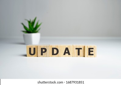 Updating Word Written In Wooden Cube, business concept. - Shutterstock ID 1687931851