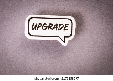 Upgrade, Communication Concept. Speech Bubble On Gray Background.