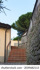 Uphill Street With Red Stairs