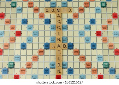 Upholland, Lancashire, UK, 25-11-2020: The Words Covid Jab Vaccination On A Scrabble Board