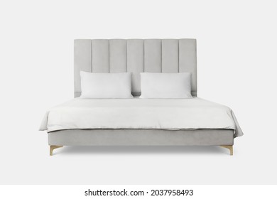 Upholstered bed with white bedding