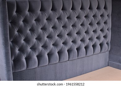 Upholstery Of A Grey Capitoned Headboard, 