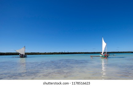 UPI BAY, ISLE OF PINES, NEW CALEDONIA, JULY 2017; Traditional Canoes Take Tourists Across The Turtle Breeding Ground Of Upi Bay. 