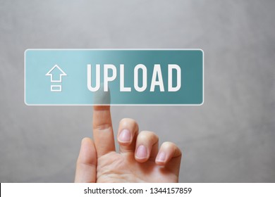 Upload - hand pressing transparent blue button with arrow on virtual touchscreen interface  grey background with copy space for text. Internet application files uploading sharing  concept.
