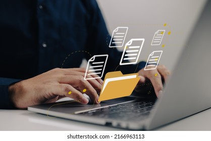 Uploading documents from folder. Open File folder with flying blank documents with laptop computer. Data transfer backup, File Sharing, Document Transferring concept. - Shutterstock ID 2166963113