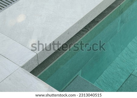 Upmarket swimming pools with lighting and marble detail