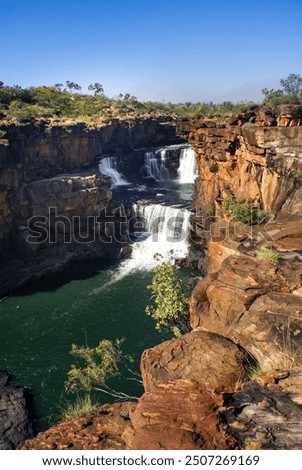 Upper cascades of Mitchell Falls, surrounded by sandstone cliffs in the Kimberleys, Western Australia