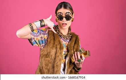 Upper Class Concept, Wealthy Rich Young Woman, Fashion Style, Close Up Holding  Gold  Bars, Funny 
Self-confident Attitude With Copy Space.