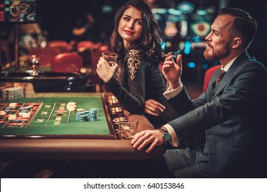 Upper Class Couple Gambling In A Casino