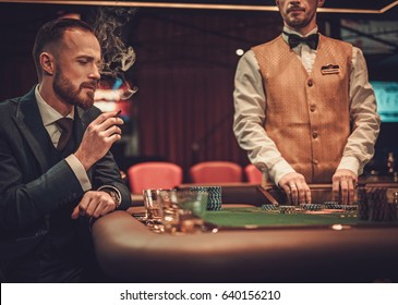 Upper Class Man Gambling In A Casino