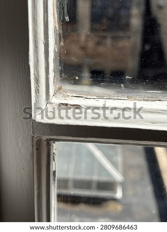 The upper corner of a sash window
