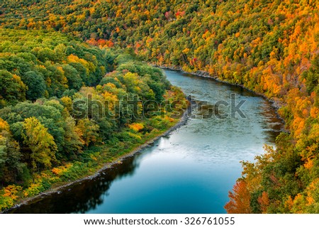 Upper Delaware river bends through a colorful autumn forest, in Hawk's Nest, near Port Jervis, New York