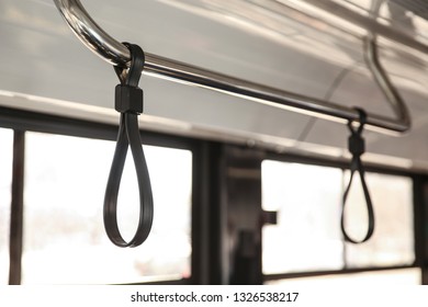 Upper Handrail In Bus. Bus Handhold. Black Strap On The Handrail In The Bus.  Bus Accessories Hand Hold Strap.