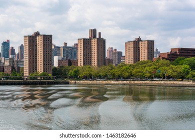 Upper Manhattan East side of New York City by the Harlem River. East Harlem is known as Spanish Harlem and dominated by public housing complexes with a high concentration of older tenement buildings.